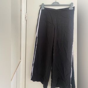 Trouser with slit on the size .